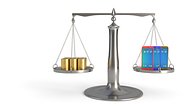 A set of scales with a sum of money on one side and mobile devices on the other